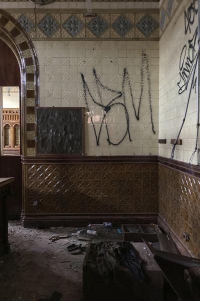 a graffitied derelict building interior