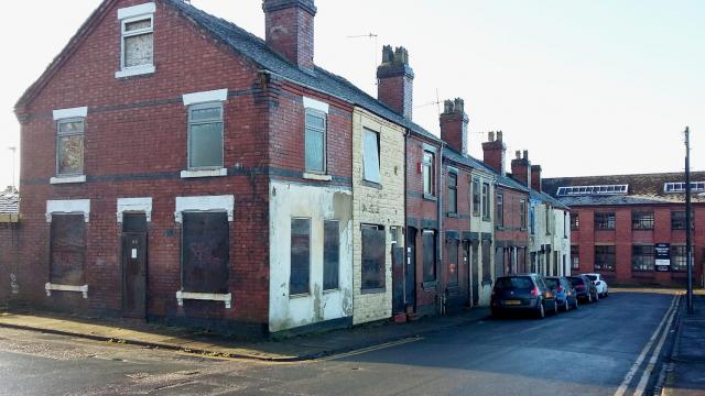 a dilapidated row of terraced houses