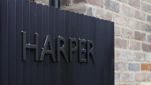 the word Harper as a sign on a black fence